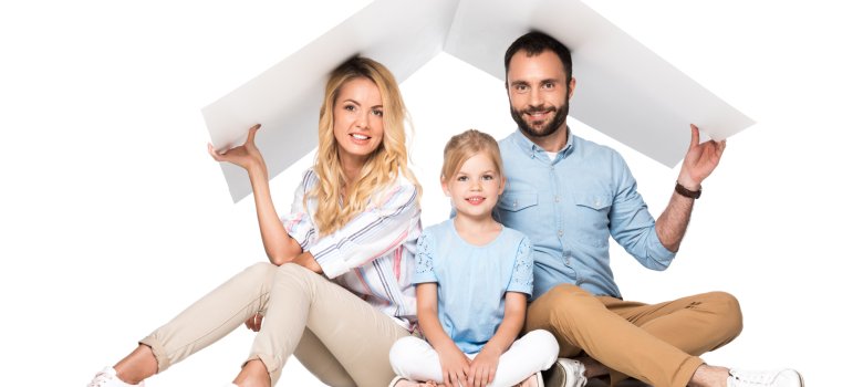 parents with daughter holding white roof over heads isolated on white, family insurance concept parents with daughter holding white roof over heads isolated on white, family insurance concept